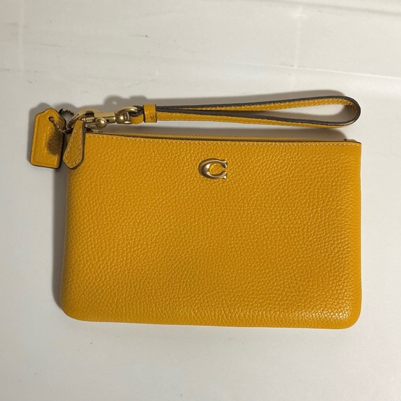 Coach Handbags - Coach Mustard Yellow Wristlet Clutch